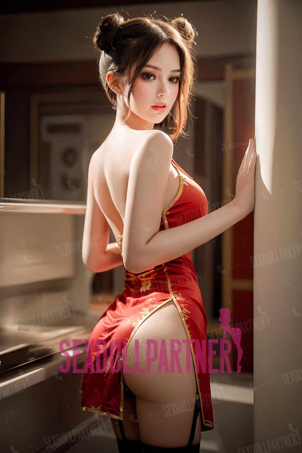 Beautiful female doll in red satin dress with lace details, posing sensually in bedroom setting.