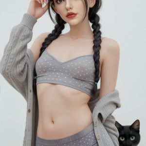 Delicate woman in polka dot lingerie with black cat, cozy cardigan, and sunglasses, facing camera.