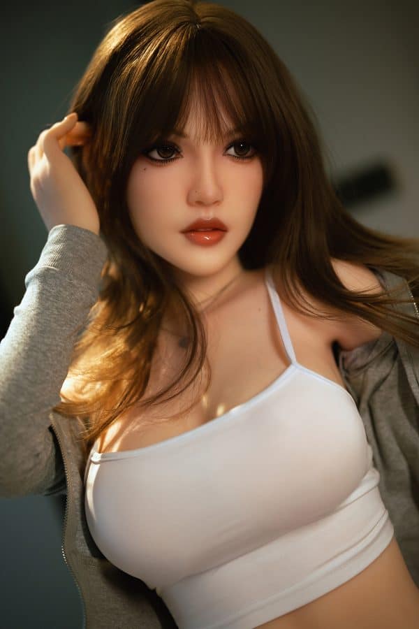 Realistic female doll with detailed facial features and brown hair, casual attire for intimate companionship.