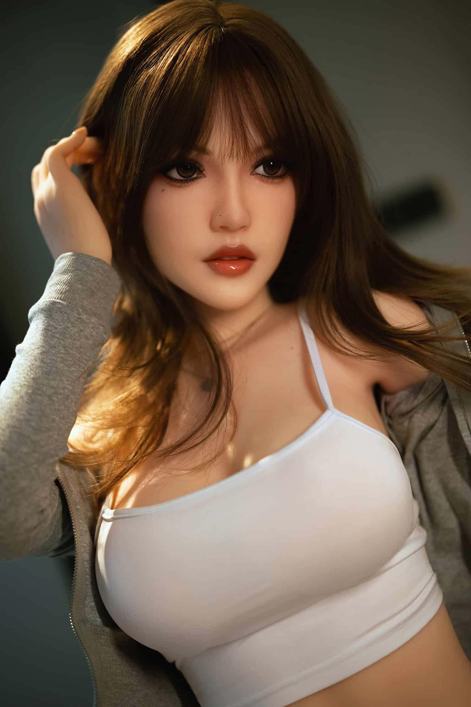 Realistic female doll with detailed facial features and brown hair, casual attire for intimate companionship.