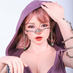 Elegant female model with gothic jewelry, pink hair, and purple hooded dress.