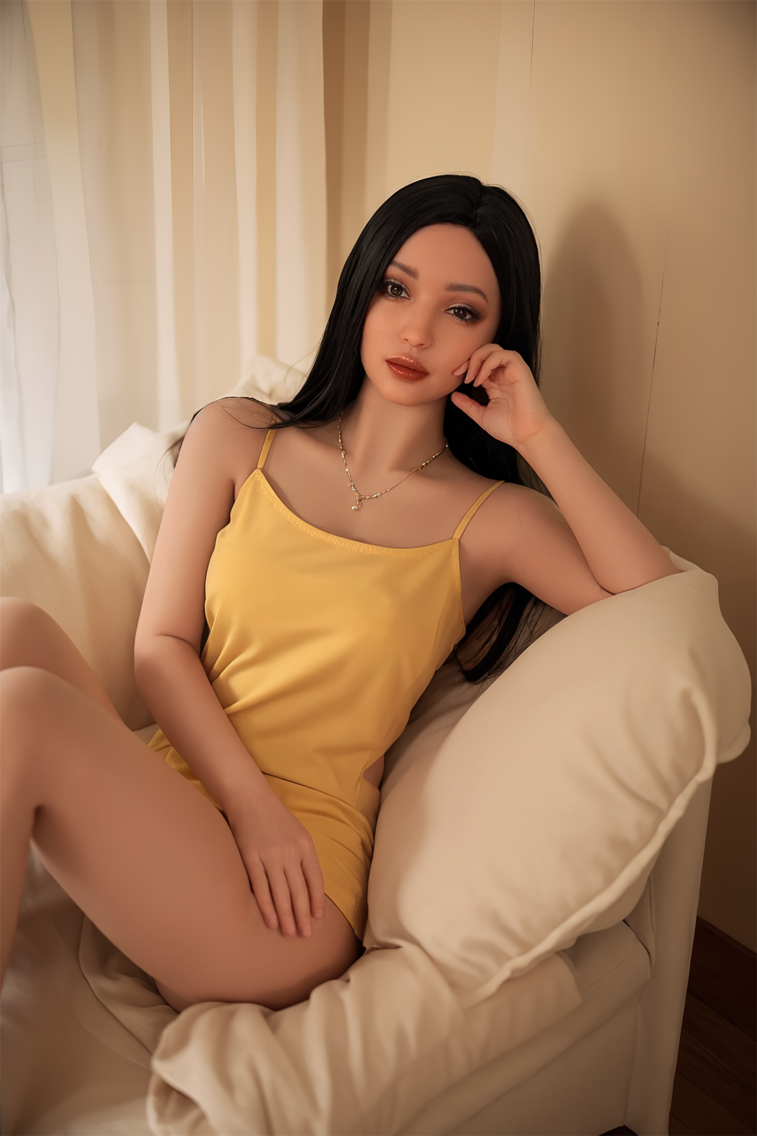 Seductive sex doll woman lounging on cream-colored sofa with black hair and yellow satin dress, realistic features, intimate setting, high-quality craftsmanship.