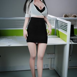 Silicone sex doll in office attire posing at desk for realistic adult love doll images.