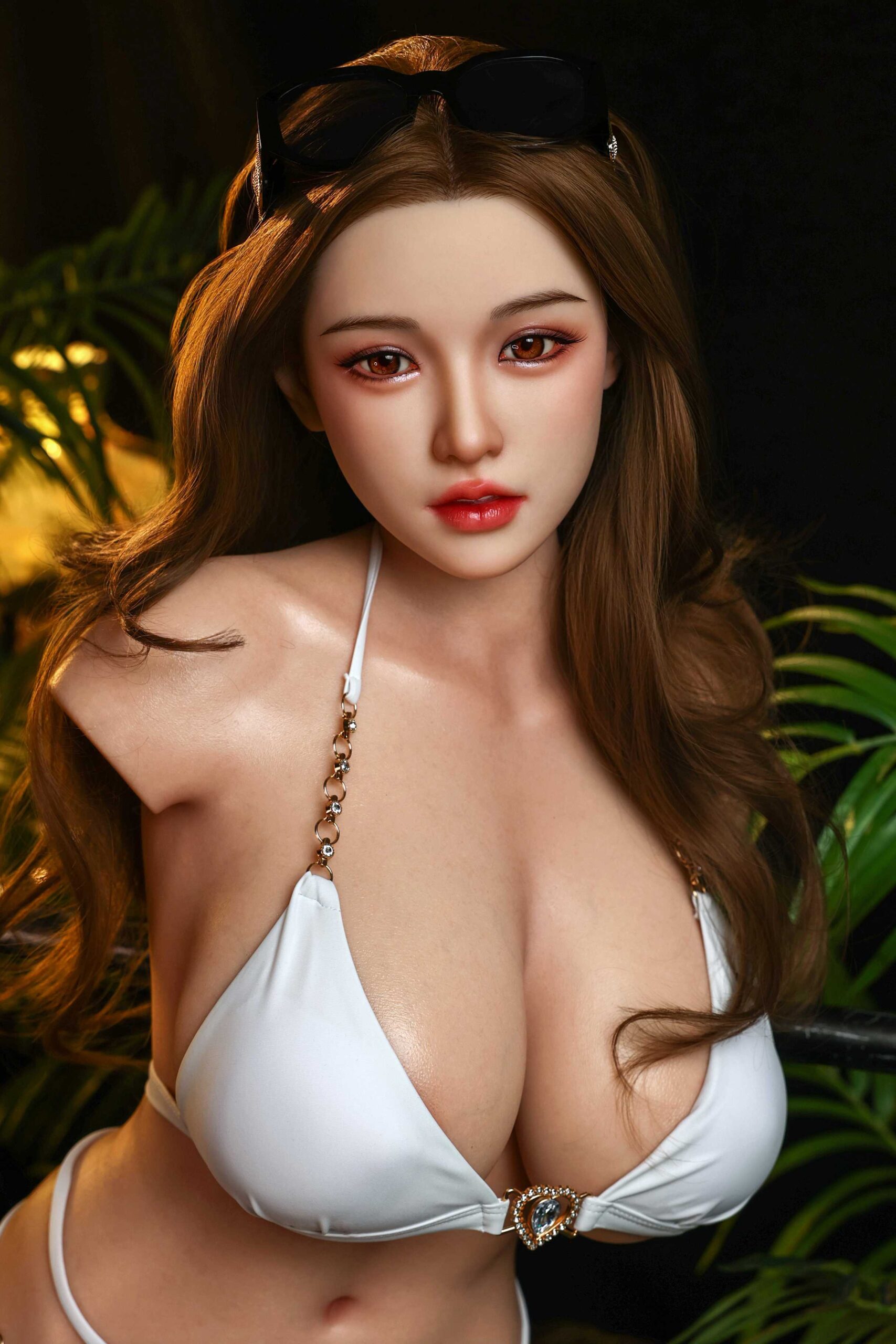 Silicone sex doll with detailed facial features, long brown hair, and white lingerie set for realistic intimacy experiences.