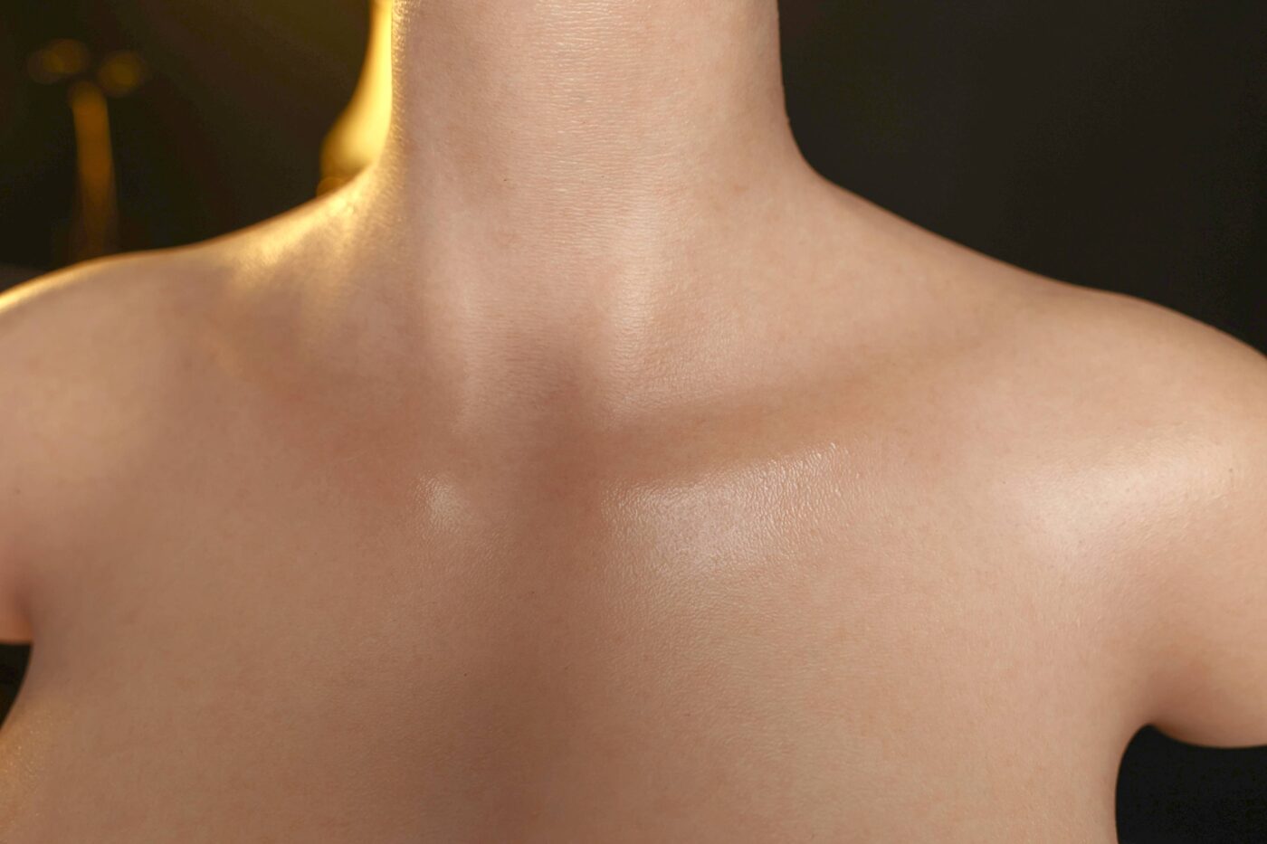 Silicone doll's smooth torso and neck, realistic skin texture, lifelike appearance for adult companionship.