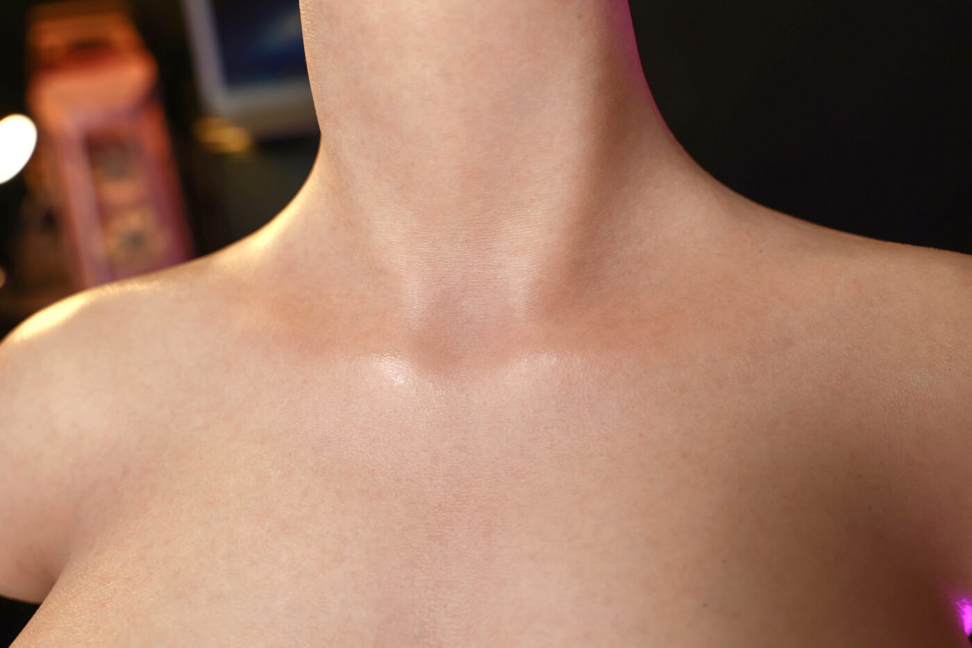 Silicone doll neck and shoulder detail, realistic skin texture, adult intimacy toy imagery.