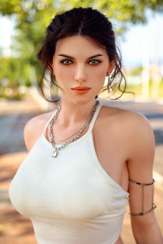 Realistic female doll outdoors with brunette hair and stylish accessories for lifelike companionship.