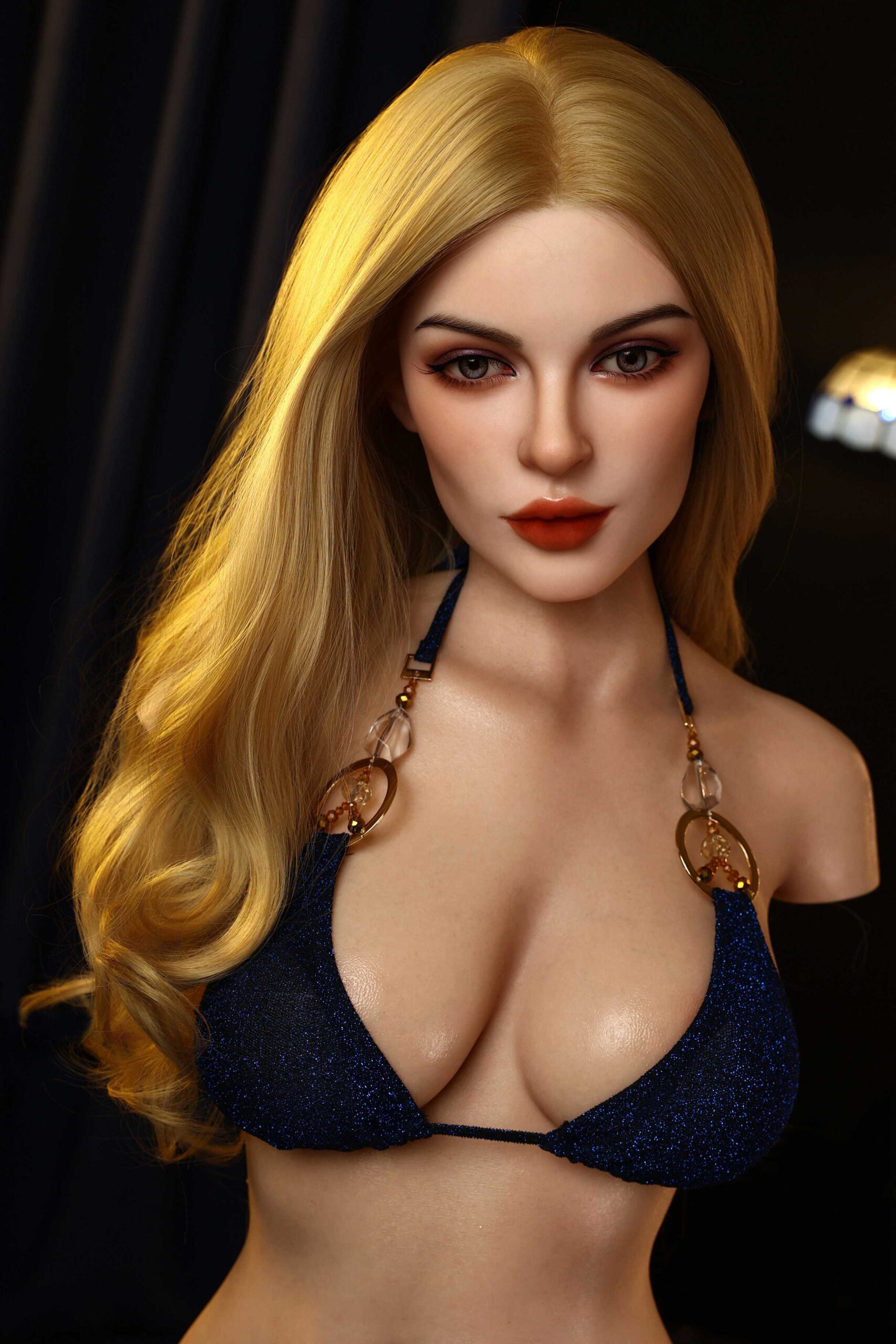 Realistic love doll with long blonde hair in a sparkly blue bikini, sensual pose for adult entertainment and companionship.