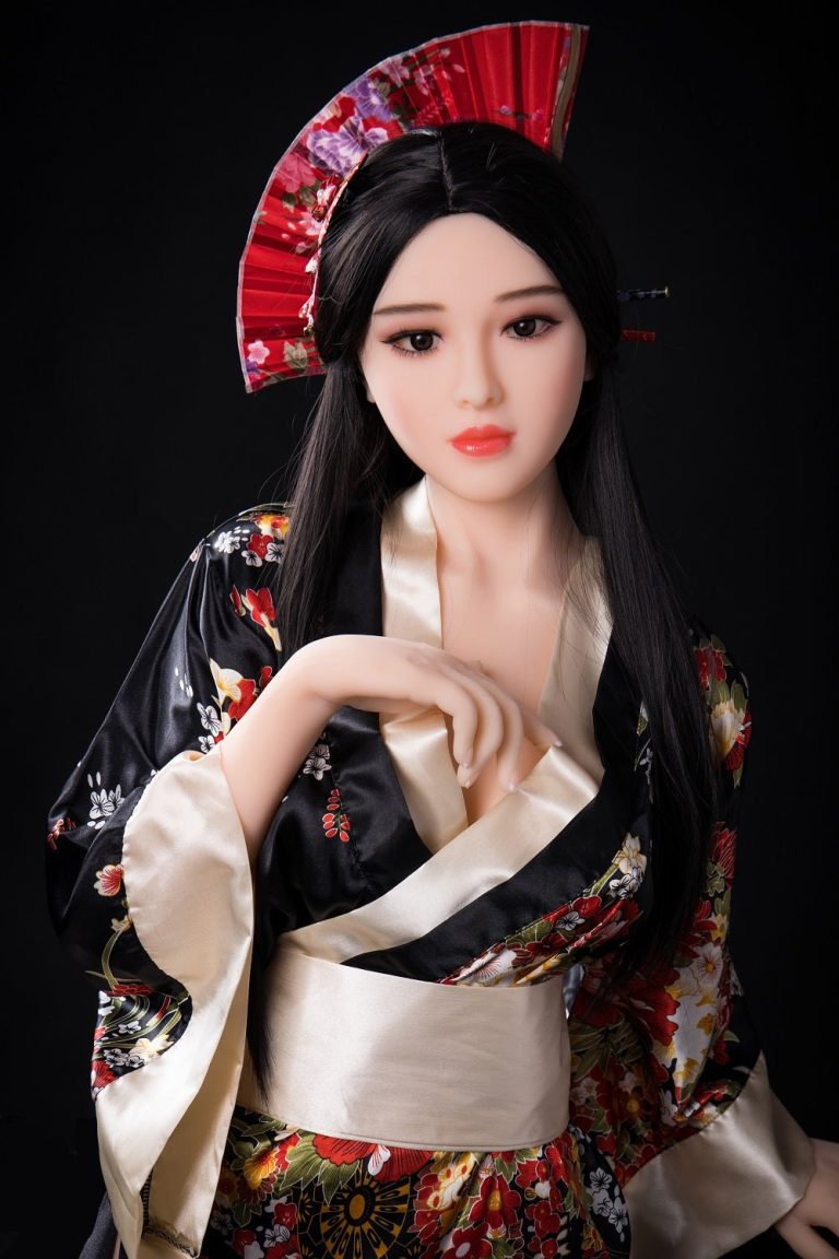 Silicone sex doll dressed in traditional Japanese kimono with hair accessories and parasol.