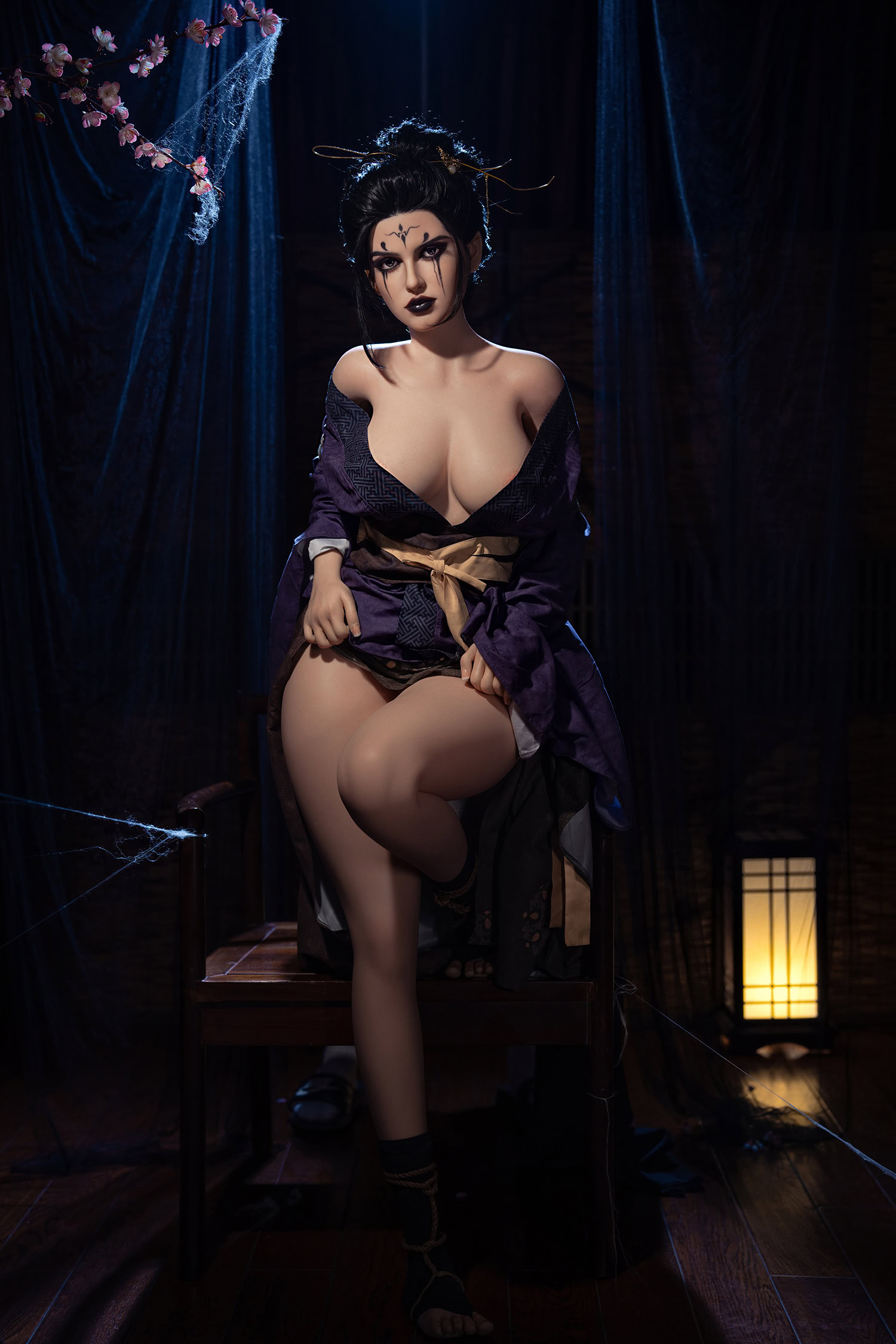 Silicone love doll with Japanese inspired costume in a dark spooky setting.