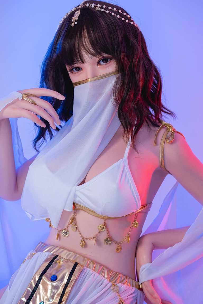 Doll wearing fashionable gold jewelry and a white outfit with a face mask, attractive cosplay, modern style artistic photo.