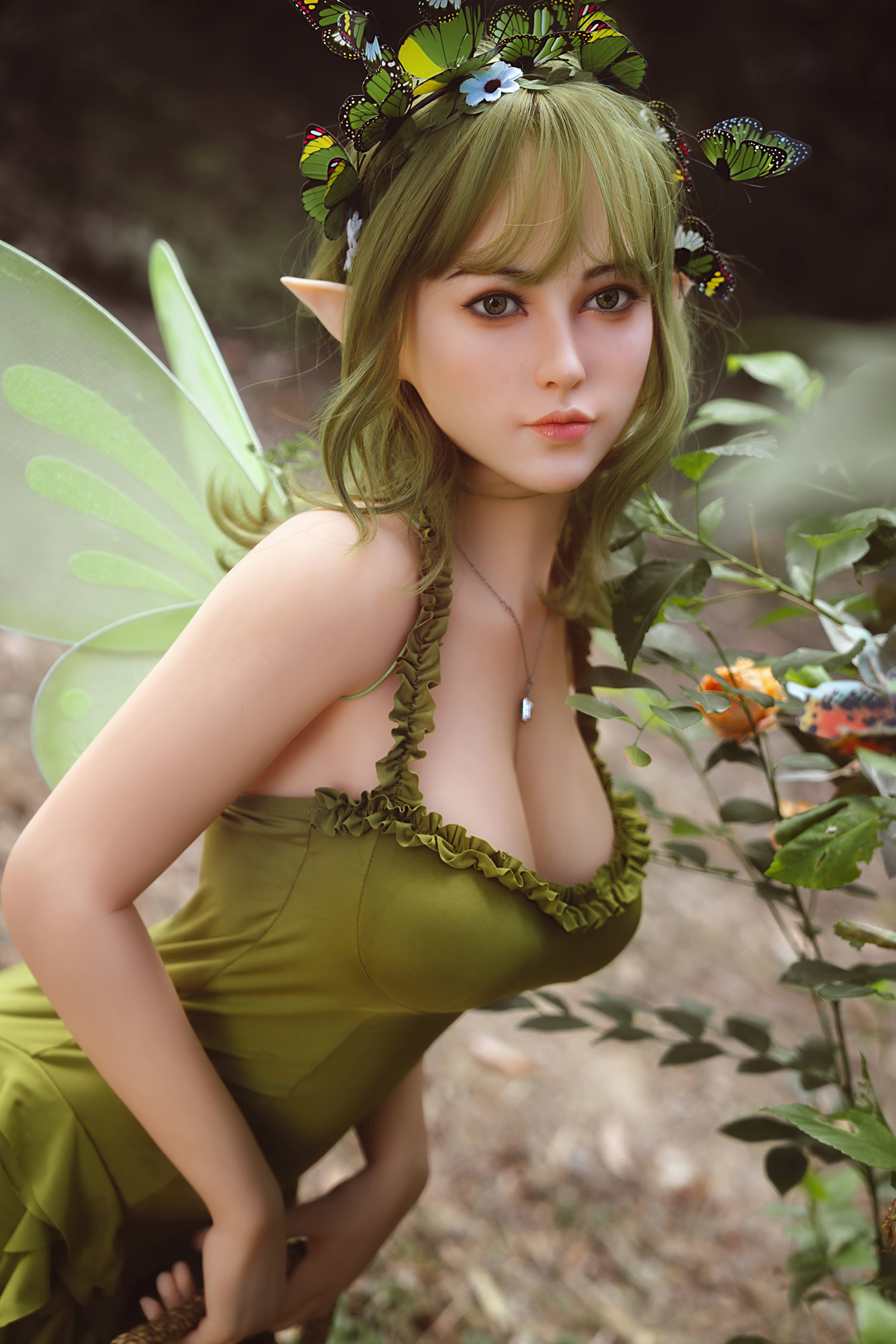 Fairy doll with wings, elf ears, and butterfly accessories in a magical forest setting.