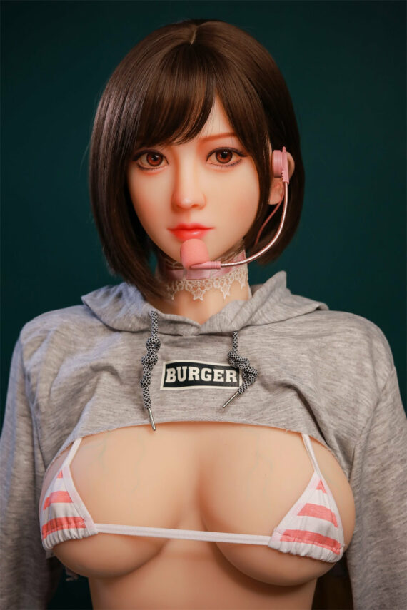 Girl with short brown hair wearing a headset and hoodie revealing a striped bikini top, marketed as a lifelike love doll.