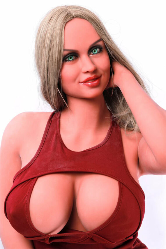 Silicone love doll model with realistic features and curly blonde hair wearing a red cutout top.