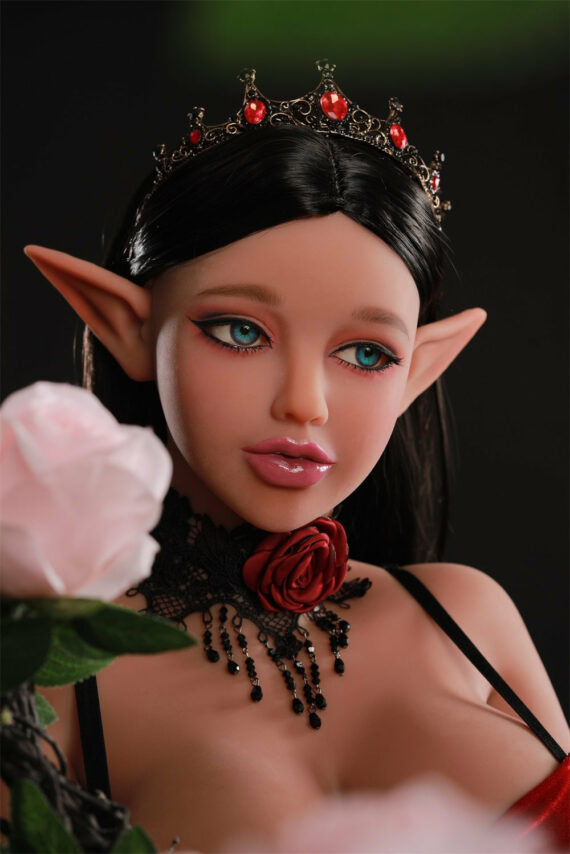 Ethereal female doll with elf ears wearing a jeweled crown and gothic jewelry, holding a pink rose.
