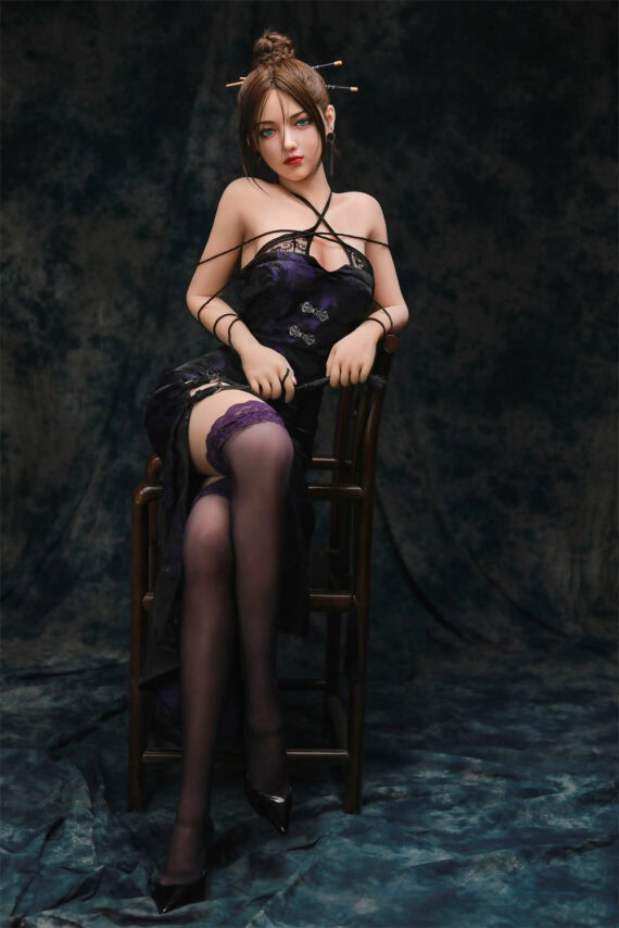Realistic sex doll in Asian-inspired dress with stockings, posing elegantly with dark backdrop.