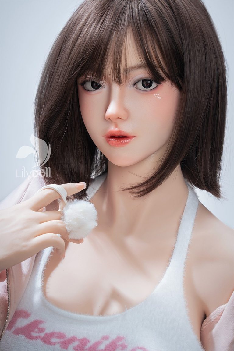 Realistic female love doll with detailed facial features, brown hair, and soft skin.