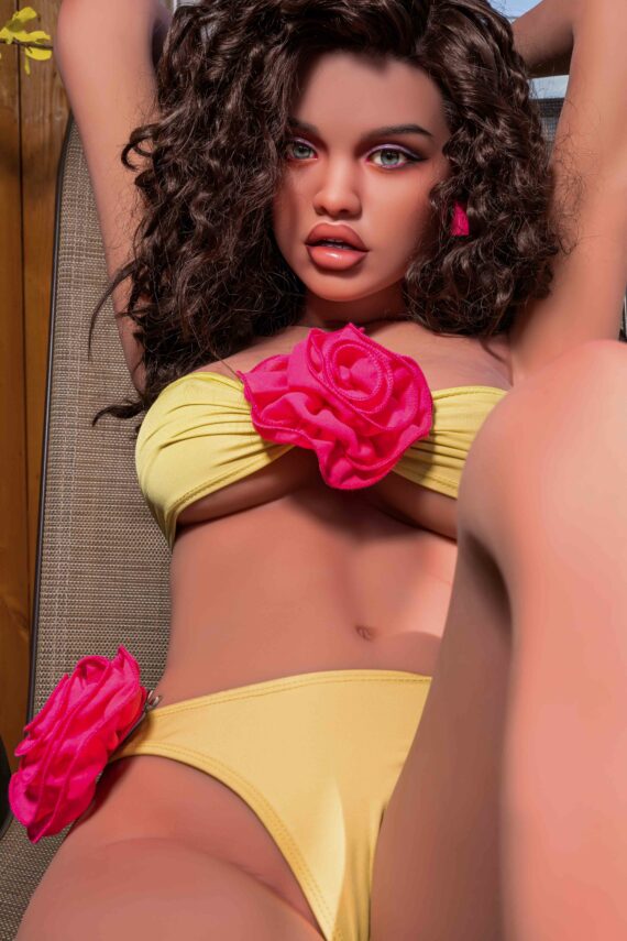 Seducedoll realistic sex doll with curly hair, yellow lingerie, and pink floral accents for adult intimacy.