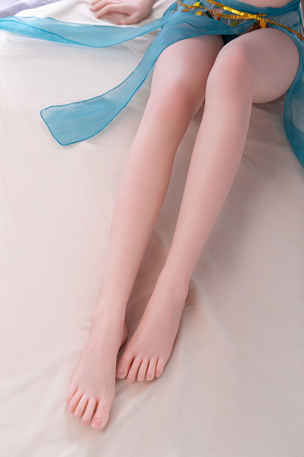 Soft, realistic silicone doll legs with smooth skin and delicate toes, perfect for lifelike companionship.