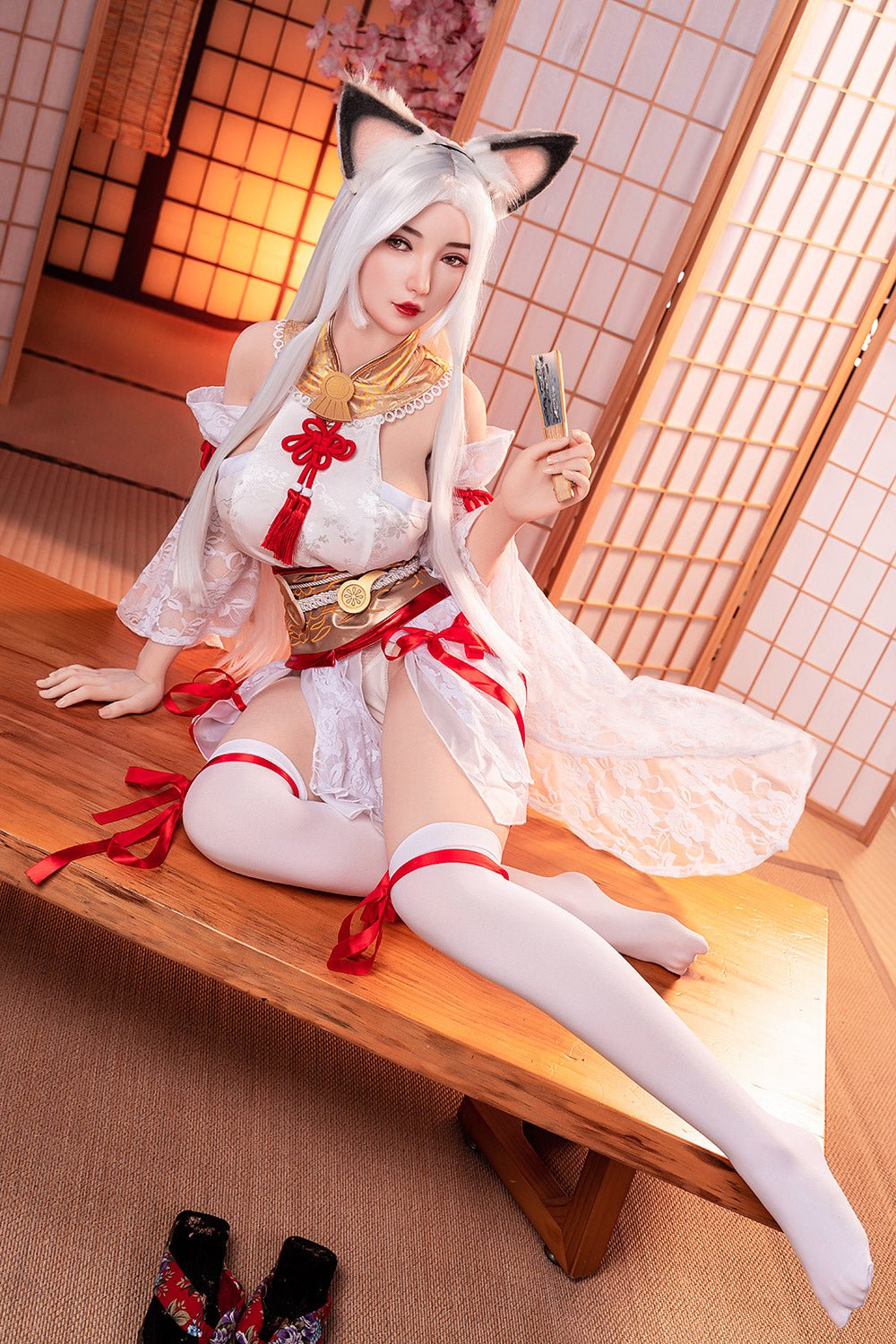 Anime-themed sex doll dressed in a Japanese-inspired costume with fox ears, in a traditional Japanese room setting.