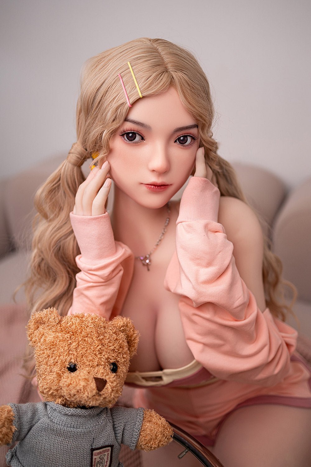 Realistic sex doll with long blonde hair and detailed features for lifelike companionship.