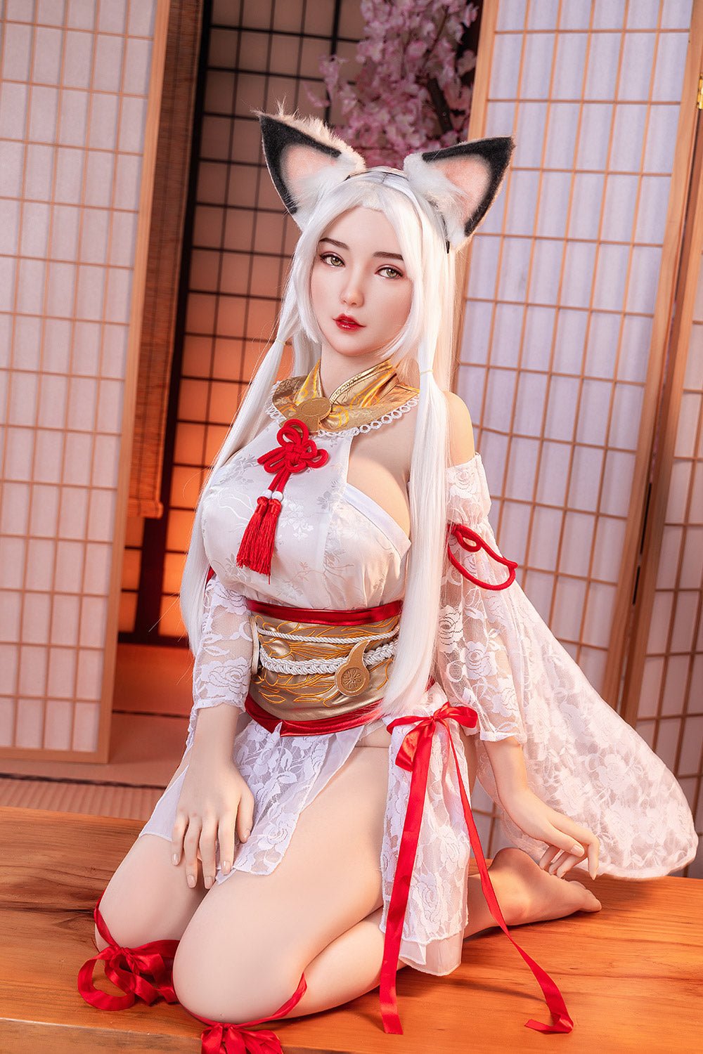 Beautiful anime-inspired doll with fox ears in traditional Japanese attire, kneeling on wooden flooring.