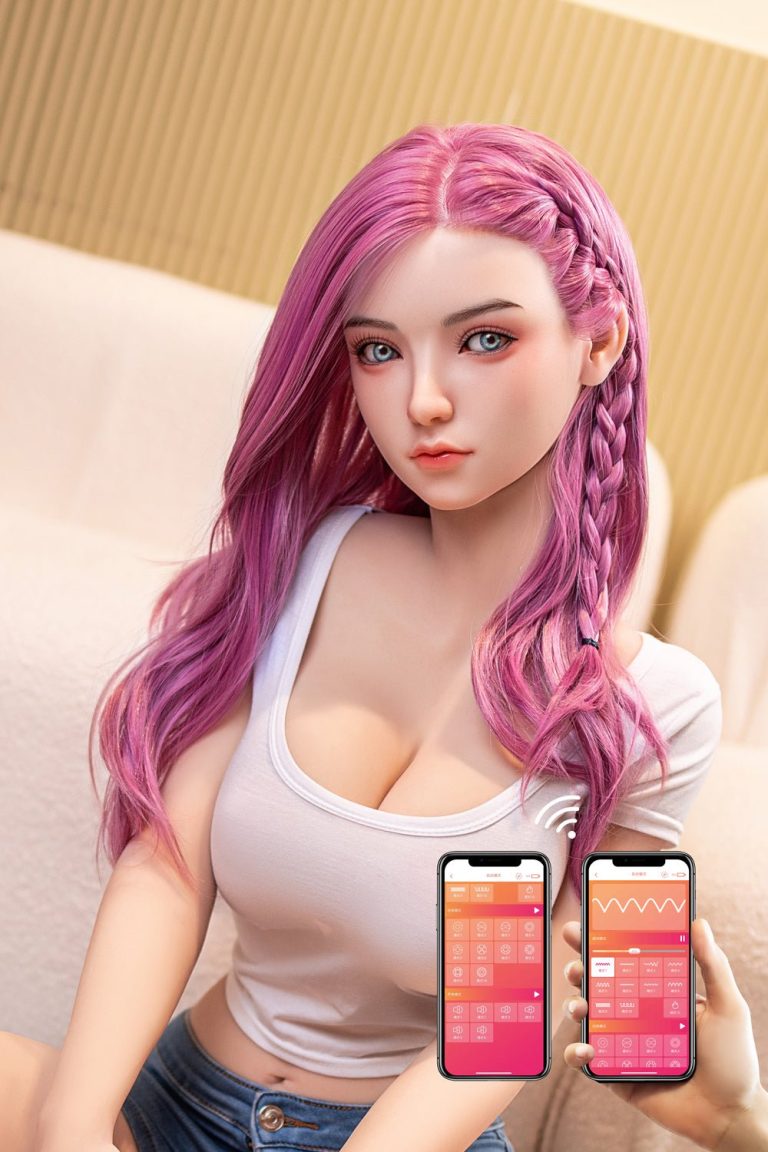 Realistic female doll with pink hair controlled via smartphone app, close-up shot.