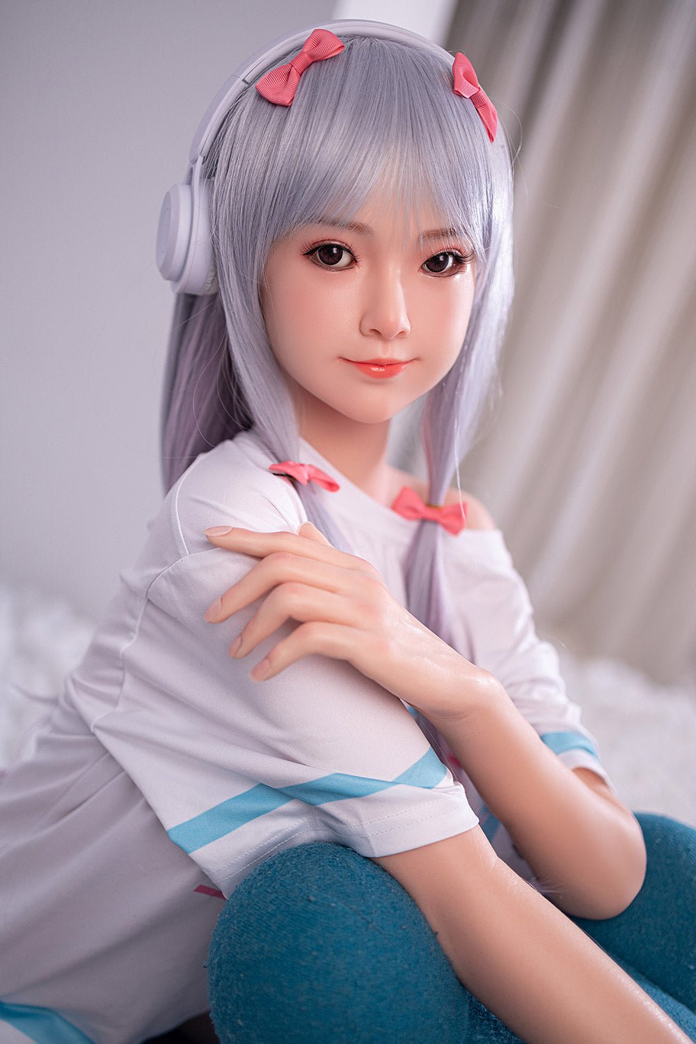 Cute anime-style love doll with silver hair and pink bows wearing headphones and casual outfit.