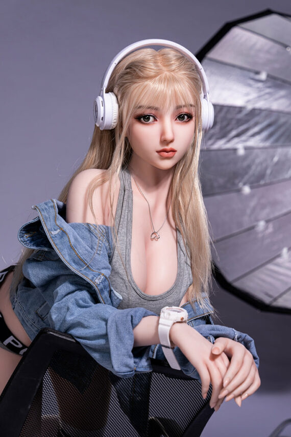 High-quality silicone sex doll with realistic features and customizable options for adult pleasure, positioned in a studio setup with professional lighting.