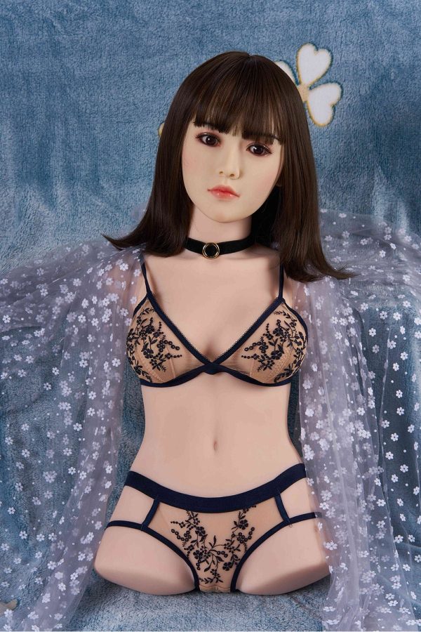 Silicone love doll in black embroidered lingerie with sheer overlay and choker necklace for intimate adult companionship.